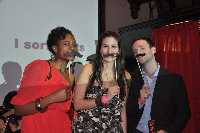 One of our fundraising events is a happy hour. Last fall, we had a photobooth company donate their service, and some party goers enjoy the props.