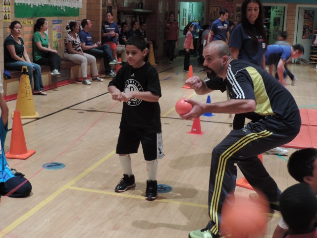 Students enjoy a field day, and concentrate really hard while playing.